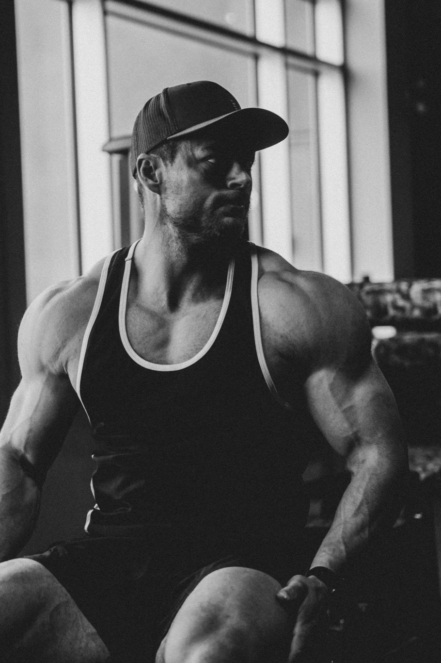 Cody coaching in the gym under hard lighting